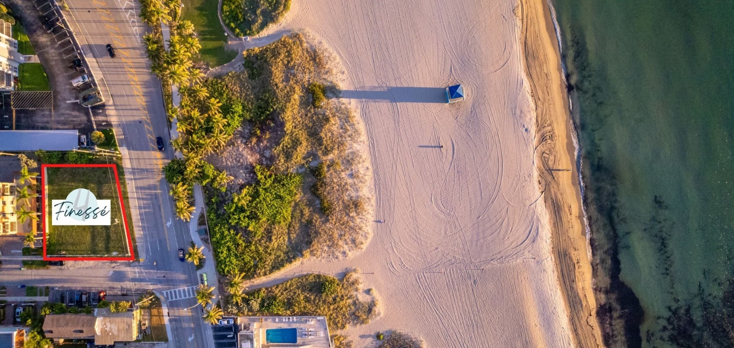 Aerial view of the lot at 499 N Ocean Blvd, outlined in red, across from the beach